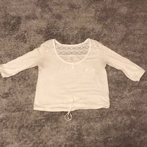 Quarter length cropped shirt.